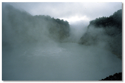 Steam from boiling water at lake's surface often clouds view
